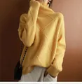 Detailed view of a yellow high-neck sweater featuring a textured diamond knit pattern - Gold Yellow