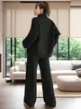 Elegant woman in a black ribbed knit loungewear set with wide-leg pants and sweater - Black