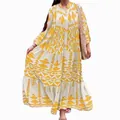 Women's yellow Bohemian printed maxi shirt dress with long sleeves and tiered skirt - S / Dresses / Yellow