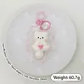 Mini white cat squishy toy made of food-grade silicone, slow rebound, 60.7g weight - Long-Tailed Fox with Bow
