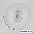 Detailed view of miniature grey Westie dog silicone squeeze toy with white bell - Westie Dog / Gray