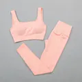 Premium koraaloranje geribbelde naadloze yogaset met sportbeha en nauwsluitende legging - S / Boven- En Onderstuk / Oranjeroze