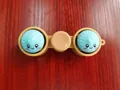 Cute emoji steamed bun fidget toy keychain in light blue and tan color - Emoji 2-Button Spinner / Without Lights / Multicolor
