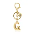 Elegant golden alphabet G keychain featuring a heart charm and secure lobster clasp - Letter G