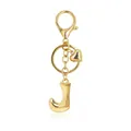 Close-up of a polished gold bubble letter J keychain with heart charm and lobster clasp - Letter J