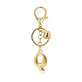Gold-toned metallic keychain with a stylized bubble letter Q pendant and heart charm - Letter Q
