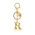 Close-up view of a golden bubble letter R keychain with lobster clasp and heart charm - Letter R