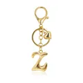 Detailed view of a golden bubble letter Z keychain with a heart charm and lobster clasp. - Letter Z