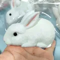 Realistic white rabbit squishy toy for stress relief and slow rebound feature. - White