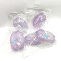 Macro shot of purple glitter squishy stress toy in transparent clear packaging bag. - Stardust Purple (Sequin Decor) / Crystal Purple