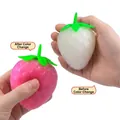 Color changing strawberry squishy stress relief toy showing before and after effect - Medium Strawberry (Color-Changing)