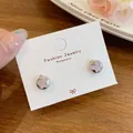 Elegant silver butterfly stud earrings featuring a soft pink cat-eye stone inlay - Pink Butterfly Cat's Eye Stone Style (HDW011)
