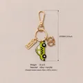 Yellow taxi and pretzel bag charm keychain made of gold-tone alloy and acrylic material - Yellow Taxi NYC