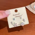 Ocean themed earring set featuring gradient sea stars, shells and faux pearls on card - Purple Blue Ocean Crystal Set