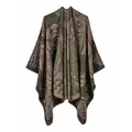 Detailed view of a double-sided split poncho with an elegant paisley pattern in olive green. - One Size / Robe / Green Paisley