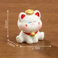 Cute miniature white Maneki-neko cat figurine with golden ingot, size 3.1cm height - Prone Style (C3555) / 3.1x2.0x2.7cm