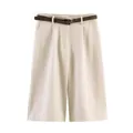 Detail view of women's beige high-waisted casual shorts with brown textured belt. - XS / Bottoms / White
