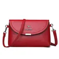 Elegant red faux leather crossbody bag for women featuring a stylish kangaroo logo design - Red