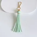 Portachiavi con nappa in pelle verde menta da 10 cm e chiusura dorata - Modello a nappe / 10cm / Verde