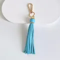 Detail view of a 10cm light blue leather tassel keychain with gold lobster clasp - Tassel Style / 10cm / Sky Blue
