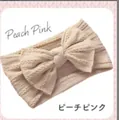 Soft peach pink nylon baby headband featuring a wide jacquard knit design and a large bow - Khaki A