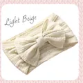 Soft cable-knit baby headband with large bow in elegant light beige color tone - Off White