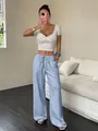 Close-up of women's light blue straight-leg trousers featuring a relaxed drawstring waist - XS / Bottoms / Blue