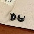 Chic black drip glaze hoop earrings featuring a stylish white heart pattern for women - Black and White Heart C-Hoop (EQT027)