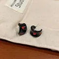 Elegant black enamel hoop earrings with red heart pattern and silver needle studs - Black and Red Heart C-Hoop (EQT028)