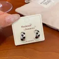 Elegant heart hoop earrings with black enamel inlay and genuine silver needle posts. - Black Heart Hoop (MLA2)