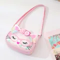Close-up view of a pink cat-themed children's crossbody bag with glitter sequins and ears - Pink + Glasses Squint Cat