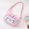 Close-up of cute pink fox cartoon crossbody bag for kids with glitter and flowers - Pink + Squint Cat