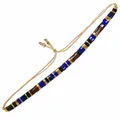 Handgefertigtes Tila-Perlenarmband mit blauen, schwarzen und goldenen Perlen - Blau Schwarz Rot Gold Marmor Gewebt
