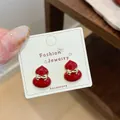 Vintage cherry red gourd-shaped stud earrings with golden bow detail on a white card - Red Bow Tie Gourd Earring (JHW012)