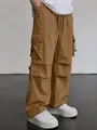 Loose-fit men's cargo parachute pants in brown with functional multi-pocket design - S / Bottoms / Earthy Yellow