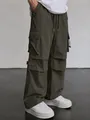 Men's techwear parachute cargo pants in olive green with loose fit straight leg. - Coffee