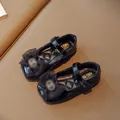 Elegant girl's black patent leather Mary Jane shoes featuring a stylish bow knot. - EU 21 / Black