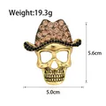 Vintage gold skull brooch with rhinestones and cowboy hat detail, measures 5.6cm by 5.0cm - Cowboy Hat Skull Style(B107-A)