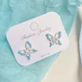 Elegant light blue gradient butterfly earrings with 925 silver posts on white card - Blue Hollow Butterfly (DG)
