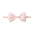 Soft elastic nylon baby headband featuring a light pink grosgrain bow hair accessory - Light Pink (105)