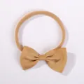 Elastic camel nylon baby headband featuring a ribbed grosgrain bow for newborns and toddlers - Camel (690)