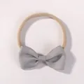 Soft grey ribbed bow headband for infants featuring a comfortable elastic nylon band. - Grey (F23)