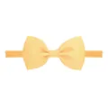 Light yellow elastic nylon baby headband featuring a ribbed grosgrain ribbon bow - Light Yellow (644)