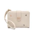 Close-up of cream women's short wallet with heart embroidery and buckle detail - Heart Embroidery Style / Apricot