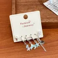 Ocean-themed silver needle earrings set with starfish and mermaid tail charms - Ocean World Theme Earring Collection