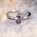 Elegant silver-toned ring with oval purple zircon and swirl crystal design - 7 / Purple Flower Style (J552) / Purple