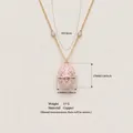 Eiförmige Medaillon-Halskette mit rosa Emaille und Herz-Edelstein inkl. Maßen - Rosa Zirkon Ranken Ei Halskette