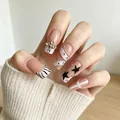 Long square press-on nails with 3D cross charms, zebra patterns, and star designs - BW220