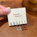 Set of three pairs of cute bear charms and geometric stud earrings for daily wear. - Two-Tone Bear Style