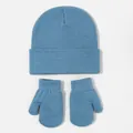 Detailed macro view of the light blue knitted texture on baby beanie and matching mitten set - Denim Blue